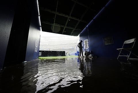 Water floods a tunnel that leads to the field during a weather delay in the World Cup Group I soccer match between France and Iraq in Philadelphia.