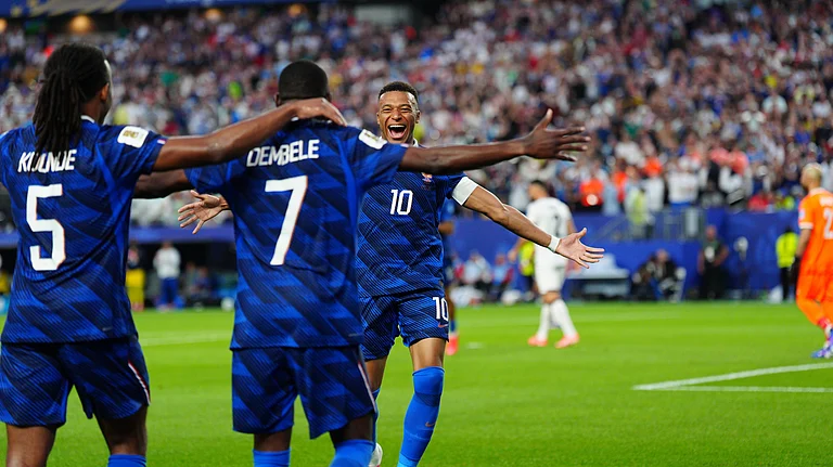France's Ousmane Dembele (7) celebrates with Kylian Mbappe (10) and Jules Kounde (5) after scoring their third goal during the World Cup Group I soccer match between France and Iraq in Philadelphia, Monday, June 22, 2026 - (AP Photo/Derik Hamilton)