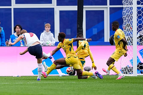England's Harry Kane (9) takes a shot and misses during the World Cup Group L soccer math