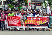 | Photo: PTI : Democratic Youth Federation of India (DYFI) supporters participate in a protest march over the UDF government’s budget proposal to slash taxes on low-alcohol beverages, in Thiruvananthapuram, Kerala.