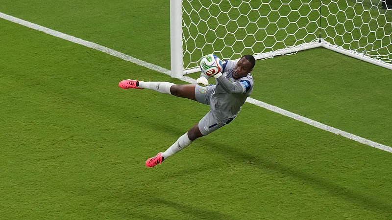 (AP Photo/Silvia Izquierdo) : Congo goalkeeper Lionel Mpasi (1) makes a save during the World Cup Group K soccer match between Colombia and Congo in Zapopan, near Guadalajara, Mexico, Tuesday, June 23, 2026.