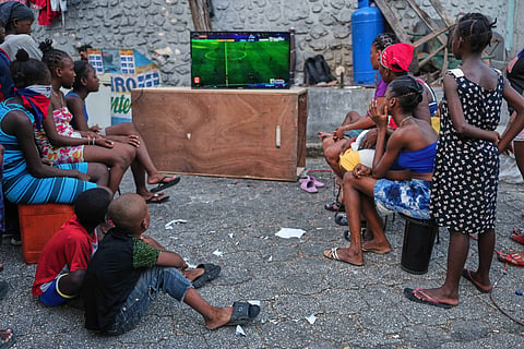 People displaced by gang violence watch a World Cup watch match between Morocco and Haiti at a shelter in Port-au-Prince, Haiti, Wednesday, June 24, 2026.