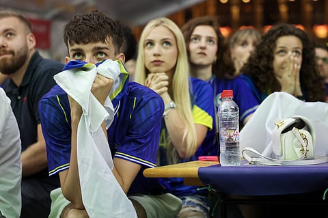 Bosnian national team soccer fans react as they watch a broadcast of the FIFA World Cup Group B soccer match between Bosnia and Qatar, at a fan zone in Sarajevo, Bosnia, Wednesday, June 24, 2026.