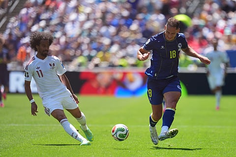 Bosnia's Nikola Katic (18) passes the ball as Qatar's Akram Afif (11) looks on during the World Cup Group B soccer match between Bosnia and Qatar in Seattle Wednesday, June 24, 2026.