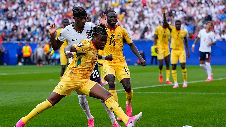 Ghana's Fatawu Issahaku (7) and England's Noni Madueke (20) battle for the ball during the World Cup Group L soccer match between England and Ghana in Foxborough, Mass., near Boston, Tuesday, June 23, 2026. - (AP Photo/Petr David Josek)