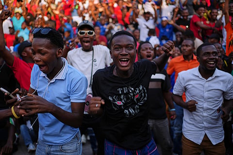 Soccer fans celebrate a goal scored by Haiti during a World Cup watch party for the match between Morocco and Haiti, in Port-au-Prince, Wednesday, June 24, 2026. 