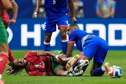 Morocco's Redouane Halhal (25) reacts after a challenge from Haiti's Lenny Joseph (16) during the World Cup Group C soccer match between Morocco and Haiti in Atlanta, Wednesday, June 24, 2026.