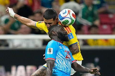 Congo's Arthur Masuaku (26) battles for the ball with Colombia's Daniel Munoz (2) during the World Cup Group K soccer match between Colombia and Congo in Zapopan, near Guadalajara, Mexico.