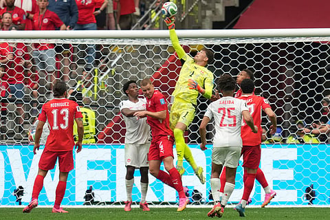 Switzerland goalkeeper Gregor Kobel (1) jumps to make a save during the World Cup Group B soccer match between Switzerland and Canada in Vancouver, British Columbia, Wednesday, June 24, 2026.