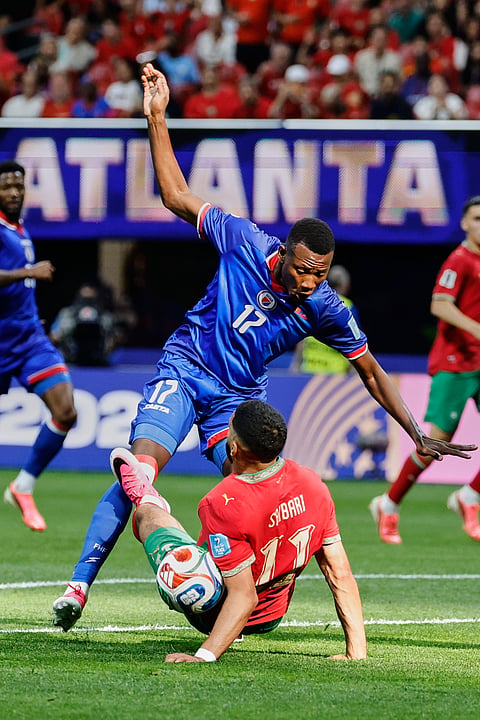 Haiti's Danley Jean Jacques (17) and Morocco's Ismael Saibari (11) collide competing for the ball during the World Cup Group C soccer match between Morocco and Haiti in Atlanta, Wednesday, June 24, 2026.