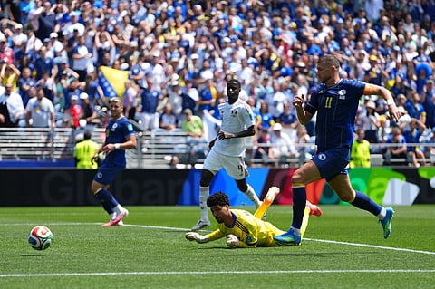 Qatar goalkeeper Mahmoud Abunada (1) tries to save the ball after an attempt by Bosnia's Edin Dzeko (11) during the World Cup Group B soccer match between Bosnia and Qatar in Seattle Wednesday, June 24, 2026. 