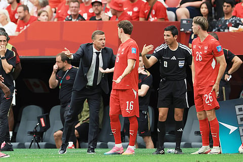 Canada head coach Jesse Marsch, left, talks with a match official during the World Cup Group B soccer match between Switzerland and Canada in Vancouver, British Columbia, Wednesday, June 24, 2026. 
