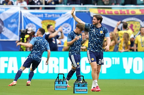 Scotland's Anthony Ralston (24) waves during warm ups before the World Cup Group C soccer match between Scotland and Brazil in Miami Gardens, Fla., Wednesday, June 24, 2026.