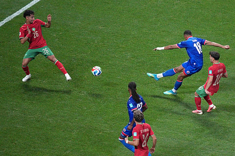 Haiti's Wilson Isidor (18) scores their second goal past Morocco's Anass Salah Eddine (26) during the World Cup Group C soccer match between Morocco and Haiti in Atlanta, Wednesday, June 24, 2026.