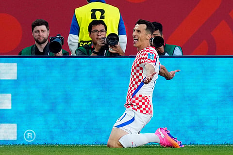 Croatia's Ante Budimir (11) celebrates a goal against Panama during the second half of a World Cup Group L soccer match, in Toronto.