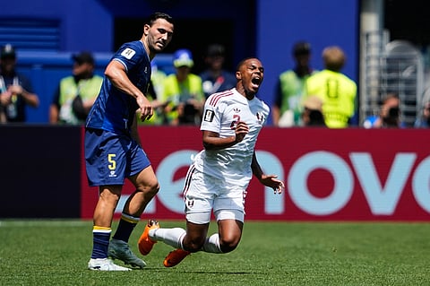 Qatar's Pedro Miguel, right, falls after he is fouled by Bosnia's Kerim Alajbegovic, not pictured, during the World Cup Group B soccer match in Seattle, Wednesday, June 24, 2026.