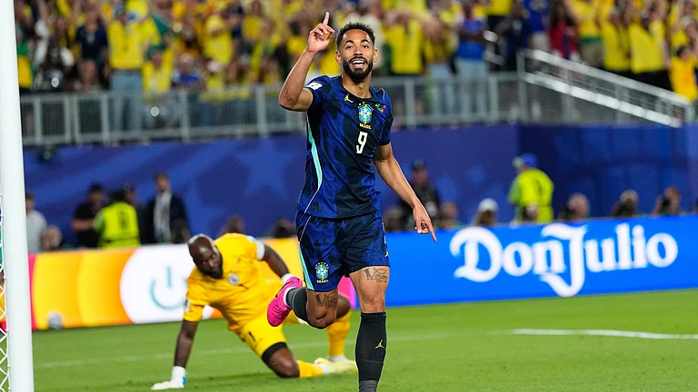 Brazil's Matheus Cunha (9) celebrates after scoring his side's opening goal during the World Cup Group C soccer match between Brazil and Haiti in Philadelphia. - AP Photo/Petr David Josek