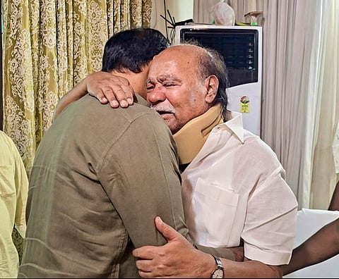 PMK founder S Ramadoss, right, embraces his son and party president Anbumani Ramadoss during a meeting at Thailapuram, near Chennai. The meeting marked a reconciliation between the father and son after a prolonged rift within the party. 