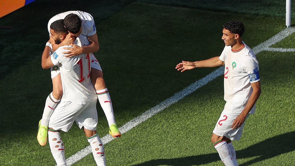 Teammates congratulate Morocco's Ismael Saibari (11) after scoring his team's first goal during the World Cup Group C soccer match between Scotland and Morocco in Foxborough, Mass., near Boston, Friday, June 19, 2026. - AP Photo/Mark Stockwell
