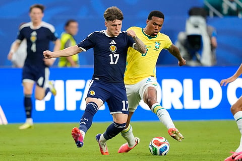Scotland's Ben Gannon-Doak (17) and Brazil's Gabriel Magalhaes (3) battle for the ball during the World Cup Group C soccer match between Scotland and Brazil in Miami Gardens, Fla., Wednesday, June 24, 2026. 