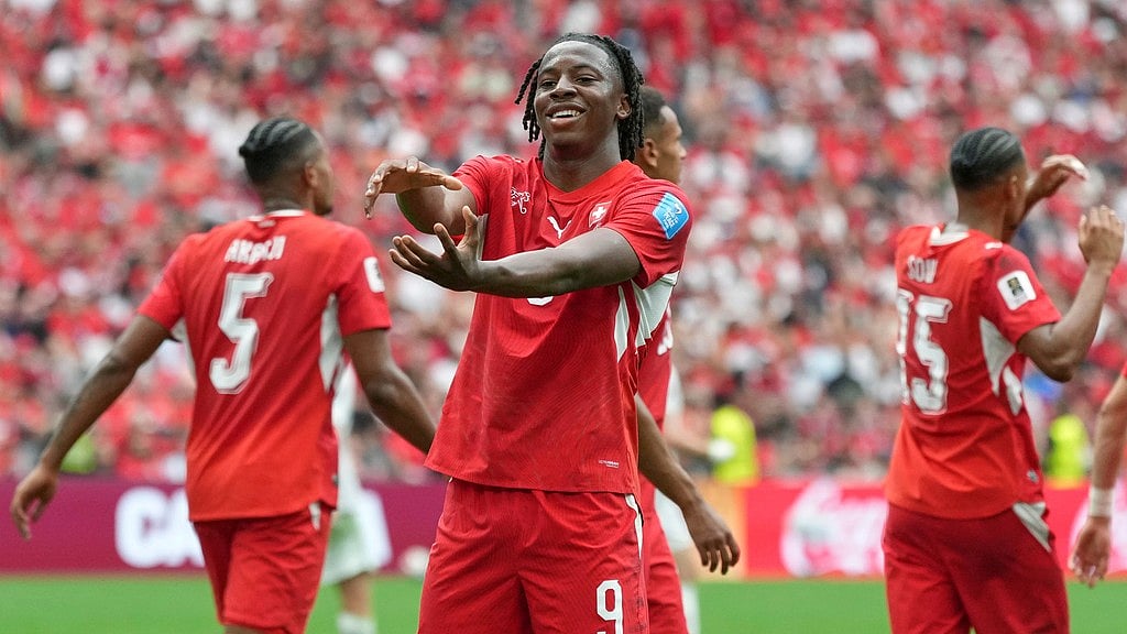Switzerland's Johan Manzambi (9) celebrates after scoring during the World Cup Group B soccer match between Switzerland and Canada in Vancouver. - Abbie Parr/AP Photo