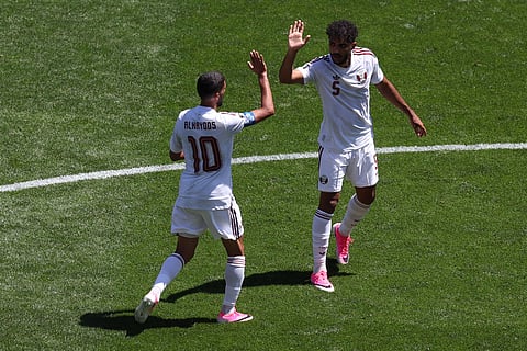 Qatar's Hassan Alhaydos (10) and Qatar's Jassem Gaber (5) celebrate after scoring during the World Cup Group B soccer match between Bosnia and Qatar in Seattle, Wednesday, June 24, 2026.