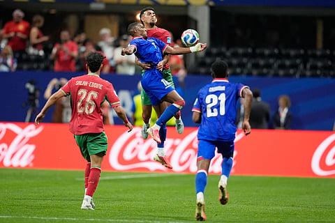 Haiti's Lenny Joseph (16) and Morocco's Chadi Riad (18) battle for the ball during the World Cup Group C soccer match between Morocco and Haiti in Atlanta, Wednesday, June 24, 2026.