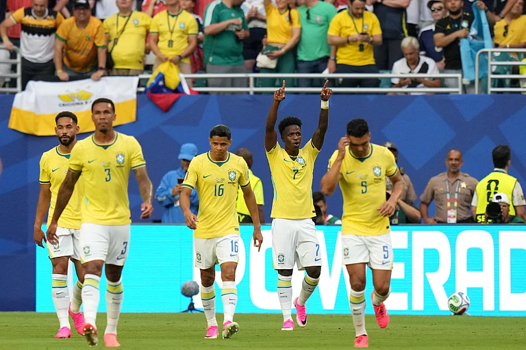 Brazil's Vinicius Junior (7) celebrates with teammates after scoring their opening goal during the World Cup Group C soccer match between Scotland and Brazil in Miami Gardens, Fla., Wednesday, June 24, 2026. - (AP Photo/Lynne Sladky)