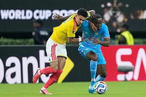 Colombia's Luis Diaz, left, challenges for the ball with Congo's Aaron Wan-Bissaka (2) during the World Cup Group K soccer match between Colombia and Congo in Zapopan, near Guadalajara, Mexico.