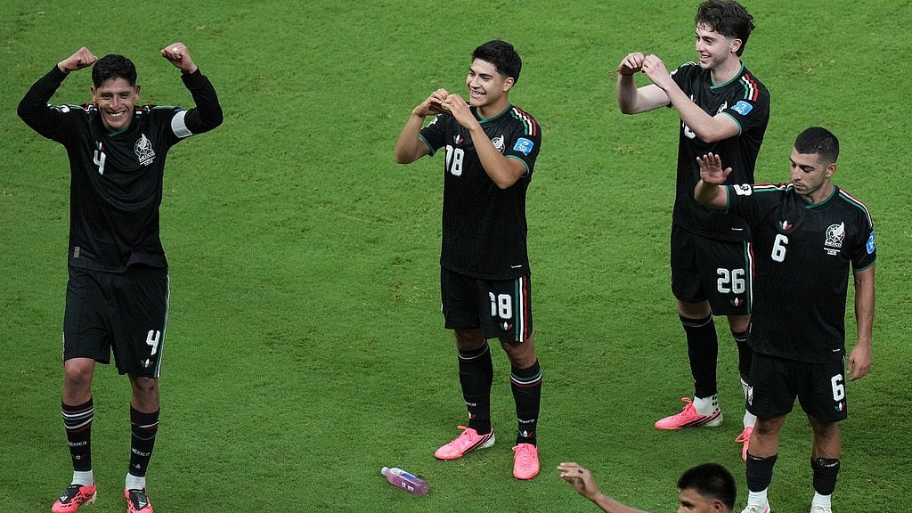 Players from Mexico celebrate after the World Cup Group A soccer match between Mexico and South Korea in Zapopan, near Guadalajara. - Silvia Izquierdo/AP Photo