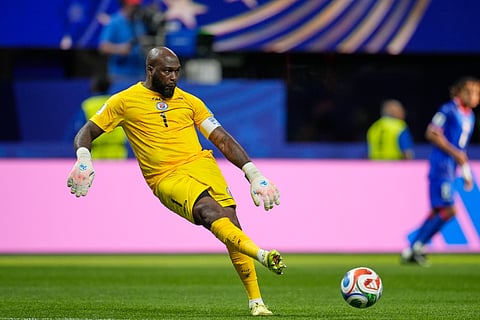 Haiti goalkeeper Johny Placide (1) passes the ball during the World Cup Group C soccer match between Morocco and Haiti in Atlanta, Wednesday, June 24, 2026.