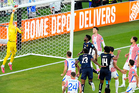 Croatia goalkeeper Dominik Livakovic (1) makes a save against Panama during the second half of a World Cup Group L soccer match, in Toronto.