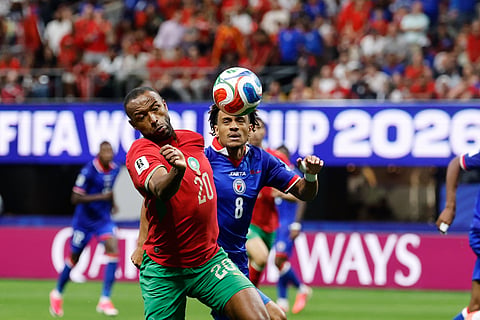 Morocco's Ayoub El Kaabi (20) and Haiti's Martin Experience (8) battle for the ball during the World Cup Group C soccer match between Morocco and Haiti in Atlanta, Wednesday, June 24, 2026.