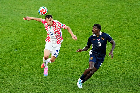 Croatia's Ante Budimir (11) heads the ball as Panama's Jose Cordoba (3) defends during the second half of  a World Cup Group L soccer match, in Toronto.
