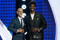 | Photo: AP/Yuki Iwamura : AJ Dybantsa, right, poses for a photo with NBA commissioner Adam Silver, left, after being selected by the Washington Wizards as the first pick in the first round of the NBA basketball draft in New York. 