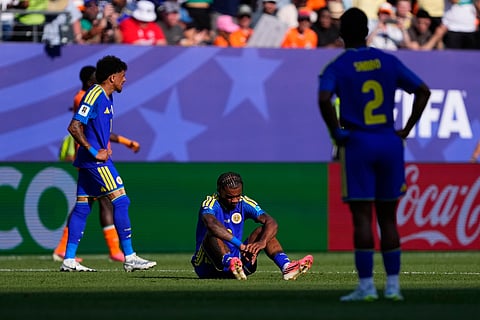 Curaçao's Juninho Bacuna (7) sits dejected after the World Cup Group E soccer match between Curacao and Ivory Coast in Philadelphia, Thursday, June 25, 2026. 