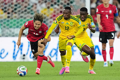 South Korea's Lee Kang-in (19), left, fights for the ball with South Africa's Thapelo Maseko (12) during the World Cup Group A soccer match between South Africa and South Korea in Guadalupe, near Monterrey, Mexico, Wednesday, June 24, 2026.