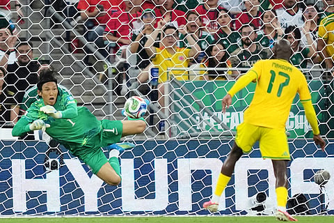 South Korea goalkeeper Kim Seung-gyu (1), left, makes a save next to South Africa's Evidence Makgopa (17) during the World Cup Group A soccer match between South Africa and South Korea in Guadalupe, near Monterrey, Mexico, Wednesday, June 24, 2026.