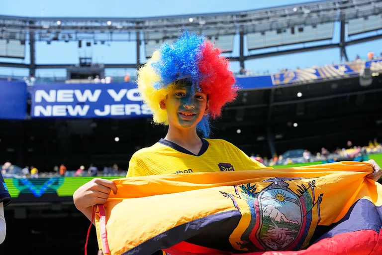 A fan of Ecuador poses for photos before the World Cup Group E soccer match between Ecuador and Germany in East Rutherford, N.J., near New York, Thursday, June 25, 2026. - (AP Photo/Frank Franklin II)