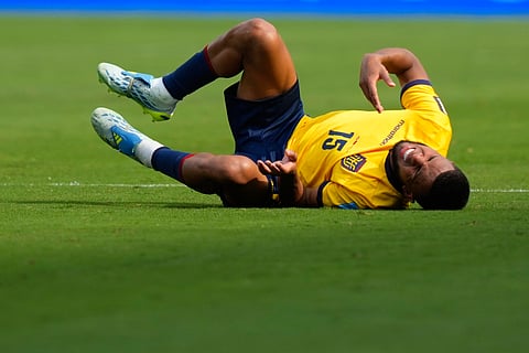 Ecuador's Pedro Vite grimaces in pain during the World Cup Group E soccer match between Germany and Ecuador in East Rutherford, N.J., near New York, Thursday, June 25, 2026.