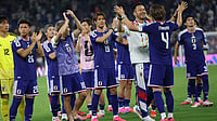 Addison Simmons/AP Photo : Japan players acknowledge supporters after the World Cup Group F soccer match between Tunisia and Japan in Guadalupe.