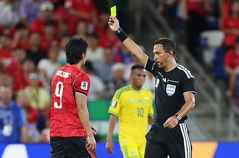 Referee Facundo Tello, of Argentina, issues a yellow card South Korea's Cho Gue-sung (9) during the World Cup Group A soccer match between South Africa and South Korea in Guadalupe, near Monterrey, Mexico, Wednesday, June 24, 2026.