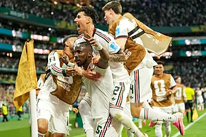 (AP Photo/Silvia Izquierdo) : Mexico's Julian Quinones celebrates scoring his side's second goal against Czechia during a World Cup Group A soccer match in Mexico City, Wednesday, June 24, 2026.
