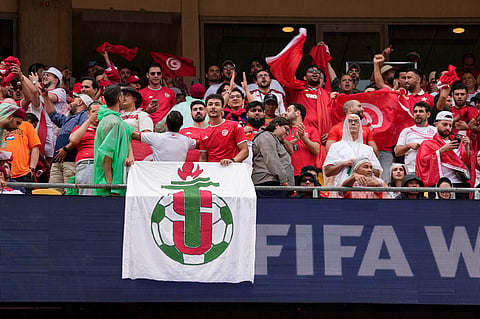 Tunisia fans cheer before the World Cup Group F soccer match between Tunisia and the Netherlands in Kansas City