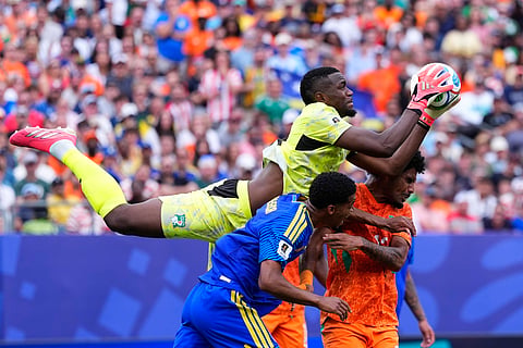 Ivory Coast goalkeeper Yahia Fofana (1) saves during the World Cup Group E soccer match between Curacao and Ivory Coast in Philadelphia, Thursday, June 25, 2026.