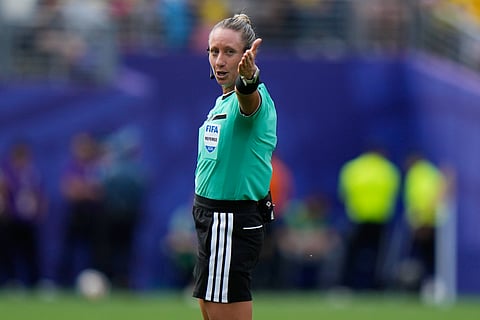 Referee Tori Penso, of the United States, gestures during the World Cup Group E soccer match between Ecuador and Germany in East Rutherford, N.J., near New York, Friday, June 26, 2026.