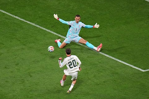 Mexico's Mateo Chavez (20) shoots and scores their opening goal against Czechia goalkeeper Matej Kovar (1) during the World Cup Group A soccer match between Czechia and Mexico in Mexico City, Wednesday, June 24, 2026.