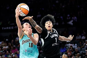| Photo: Steve Marcus/Las Vegas Sun via AP : New York Liberty guard Pauline Astier (18) shoots against Las Vegas Aces forward Kierstan Bell (1) during the first half of an WNBA basketball game in Las Vegas.