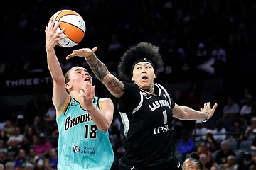 | Photo: Steve Marcus/Las Vegas Sun via AP : New York Liberty guard Pauline Astier (18) shoots against Las Vegas Aces forward Kierstan Bell (1) during the first half of an WNBA basketball game in Las Vegas.