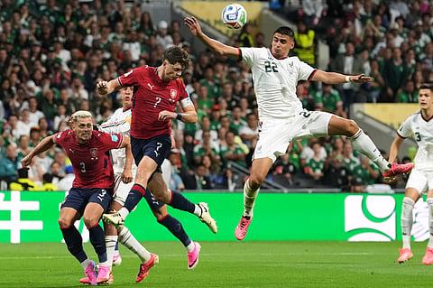 Mexico's Guillermo Martinez (22) and Czechia's Ladislav Krejci (7) compete to head the ball during the World Cup Group A soccer match between Czechia and Mexico in Mexico City, Wednesday, June 24, 2026.